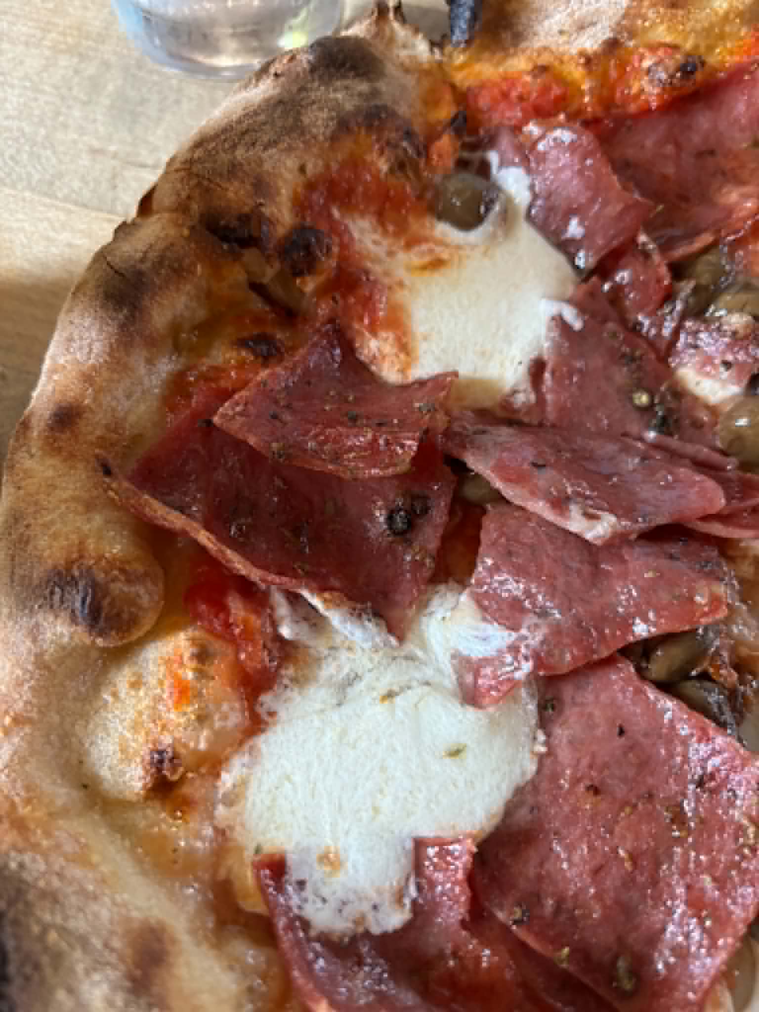 Salami pizza with blistered crust and melted mozzarella at Pizzeria Bianco in Phoenix